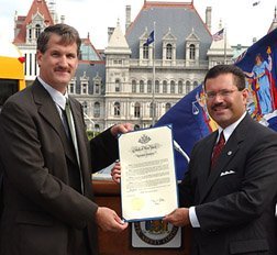 Scott Goble, President of NYAPT accepting Governor Pataki's Proclamation from Commissioner Martinez
